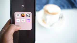 a person holding a cell phone in their hand